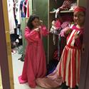 Two students dressing up in costumes.