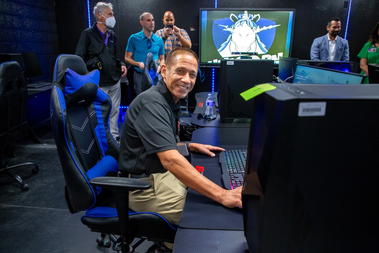 Superintendent Dr. Trujillo smiles at one of the new eSports computers