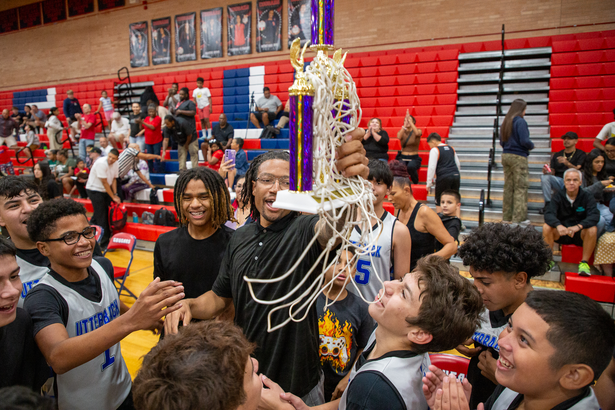 Utterback players hold up their trophy proudly!