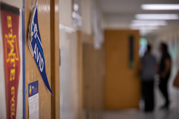 A blue AVID pennant on a classroom door