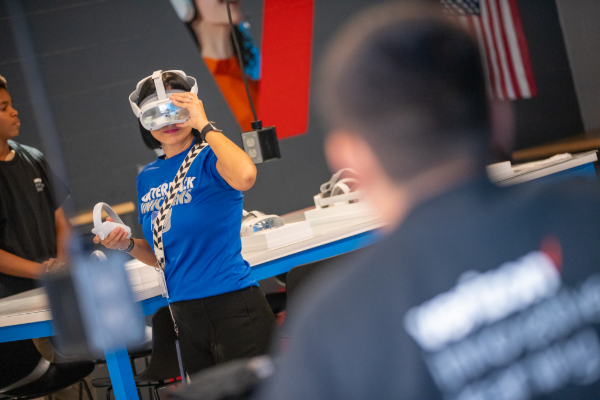 A woman uses virtual reality goggles